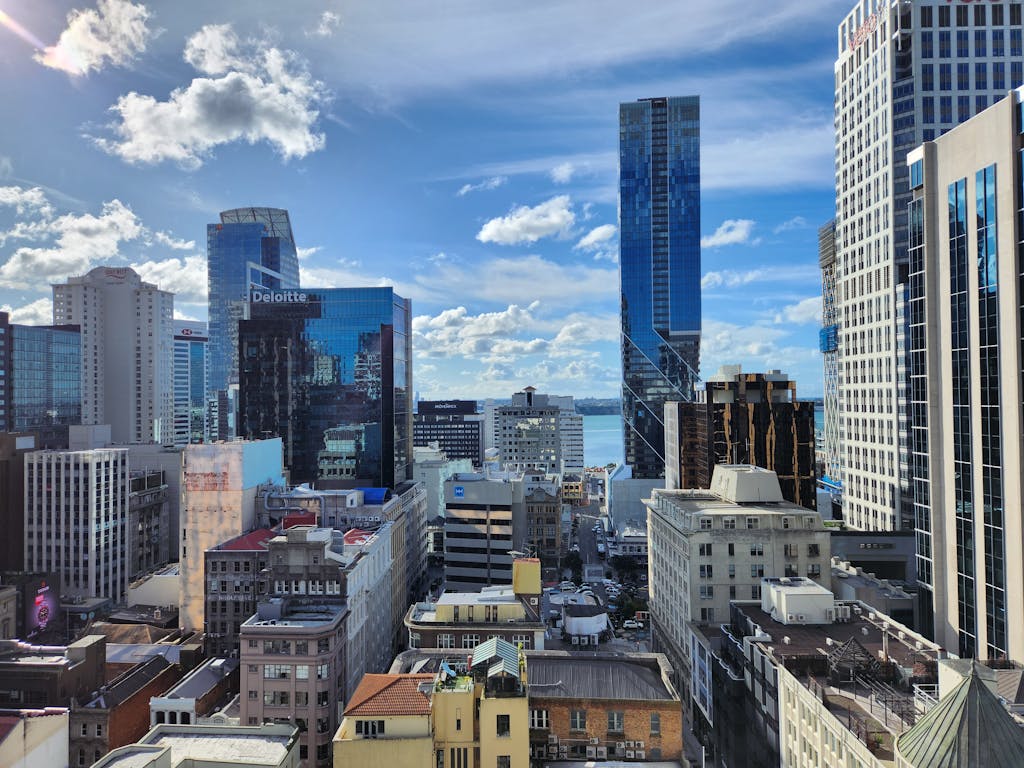 Stunning view of Auckland's urban skyline with modern skyscrapers under a clear blue sky.